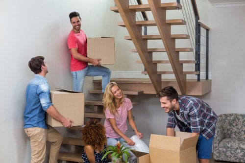 Removal van and moving team in a London street