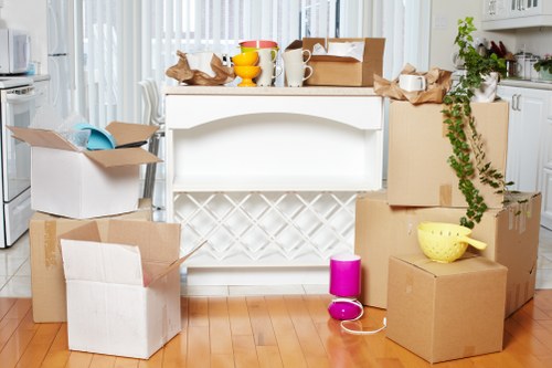 Packed boxes and furniture ready for a moving van service in London