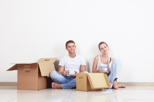 Professional London man with van handling furniture carefully