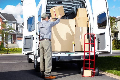 Moving team handling household items during a London man and van job