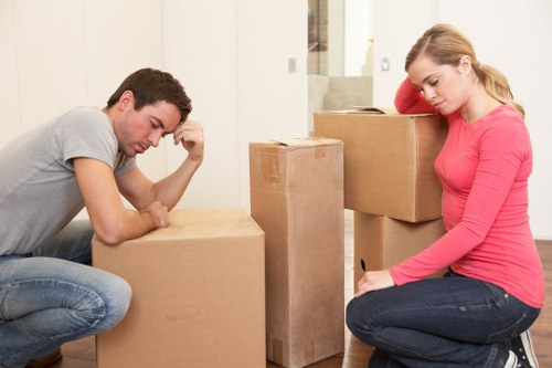 Removal team loading furniture into a van in London