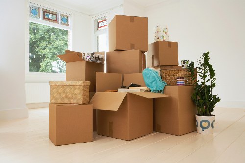 Packed moving boxes and furniture ready for transport in London