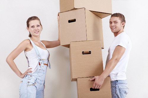 London flat move with boxes and furniture in hallway