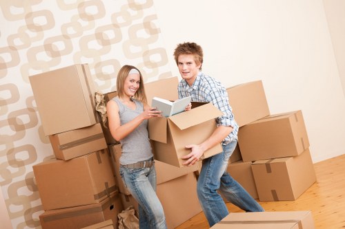Team moving office furniture and equipment in London