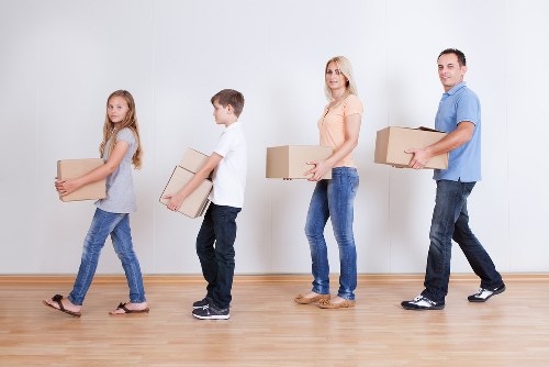 Moving van and crew handling a house relocation in London