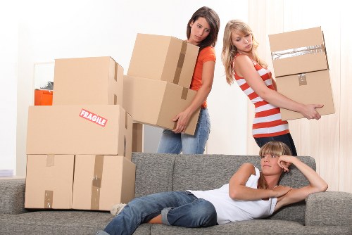 Removal team loading boxes and furniture for a London move