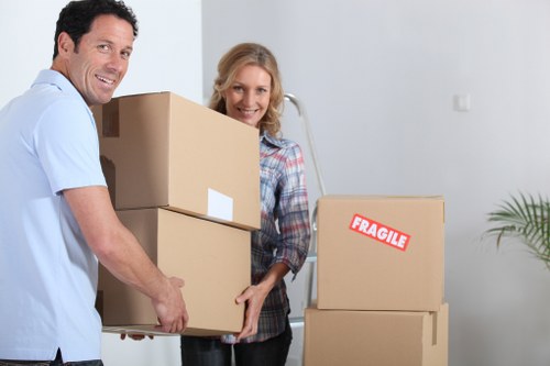 London moving team handling boxes and furniture